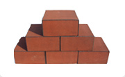 Six red ballistic containment blocks arranged